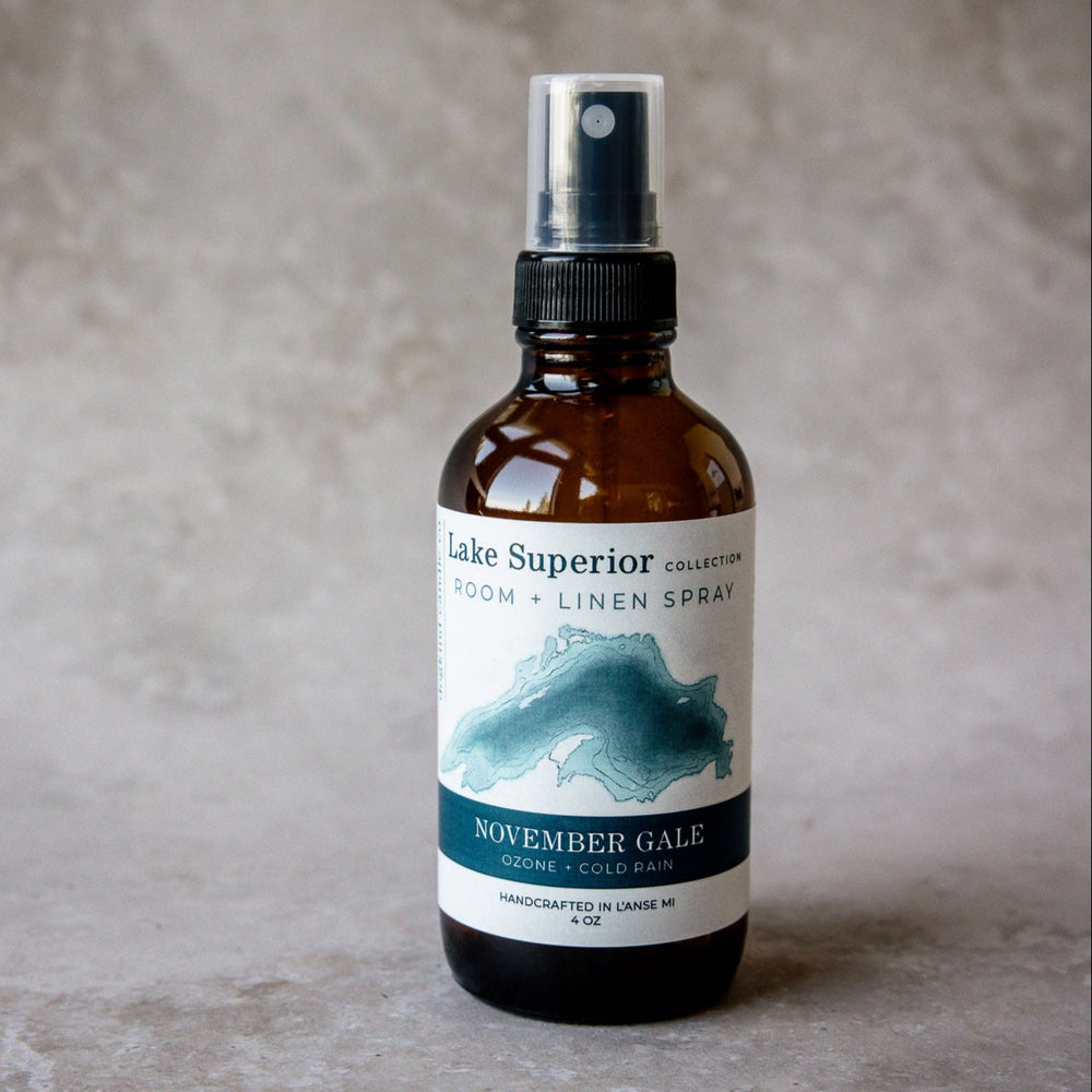 
                  
                    Bottle of Lakee Superior Room & Linen Spray november gale ozone and cold rain scent on a textured surface
                  
                