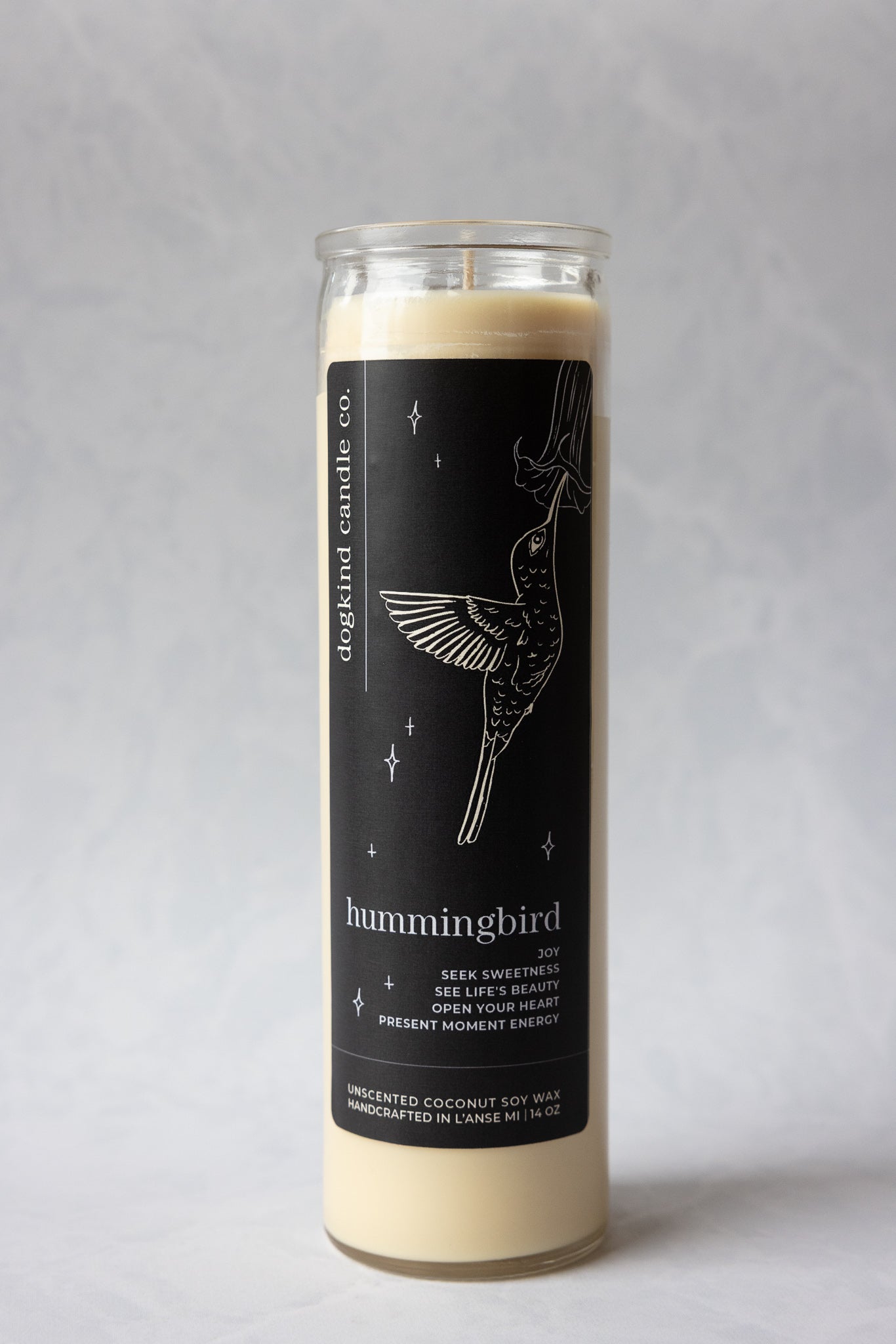 
                  
                    Animal medicine spirit animal unscented Candle with a black label featuring a hummingbird design on a gray background
                  
                