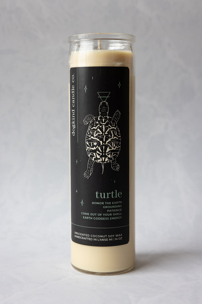 
                  
                    Animal medicine spirit animal unscented Candle with a turtle design on the label against a gray background
                  
                