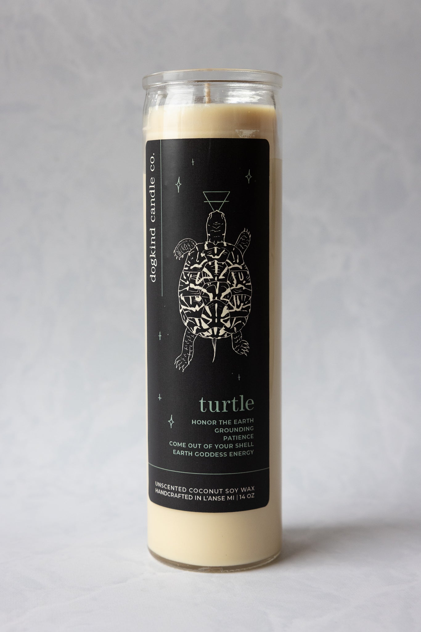 
                  
                    Animal medicine spirit animal unscented Candle with a turtle design on the label against a gray background
                  
                