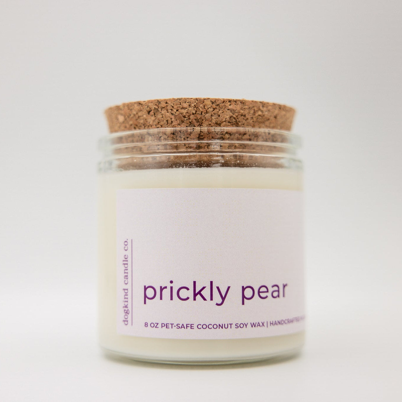 
                  
                    Candle jar labeled 'prickly pear' with a cork lid on a white background
                  
                