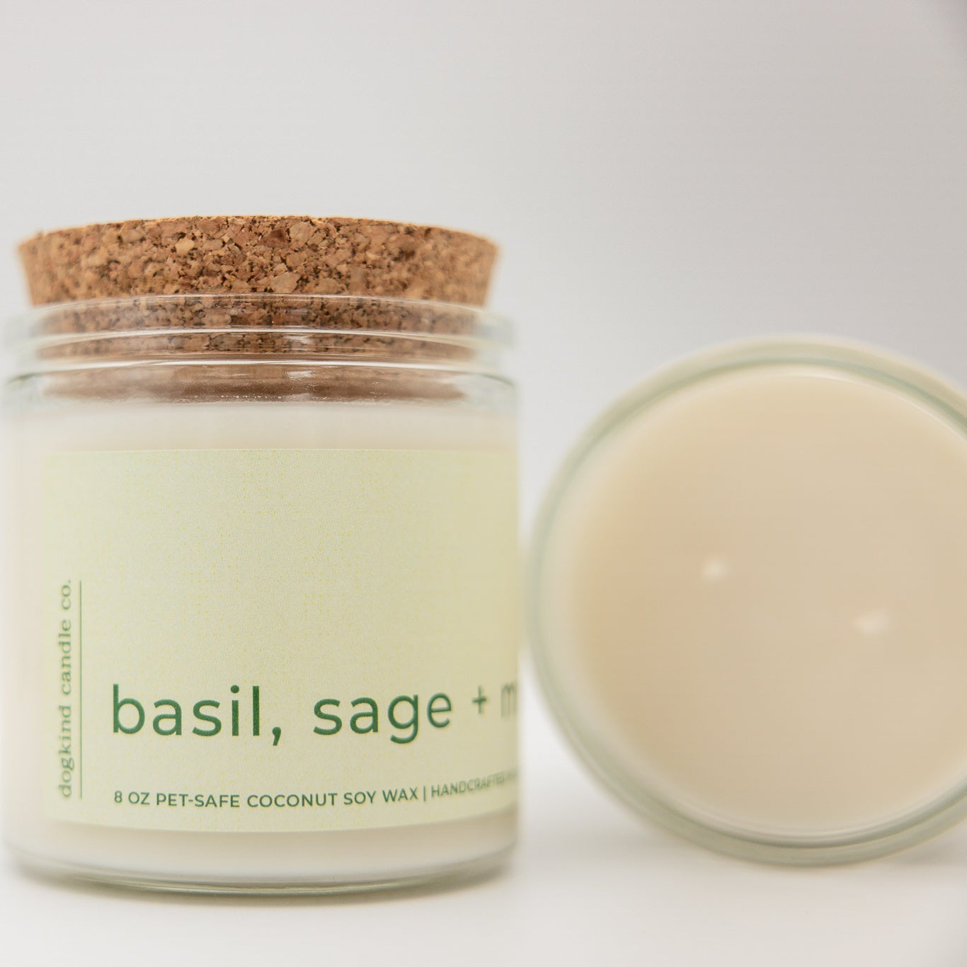 
                  
                    Candle jar labeled 'basil, sage' with a cork lid on a white background
                  
                