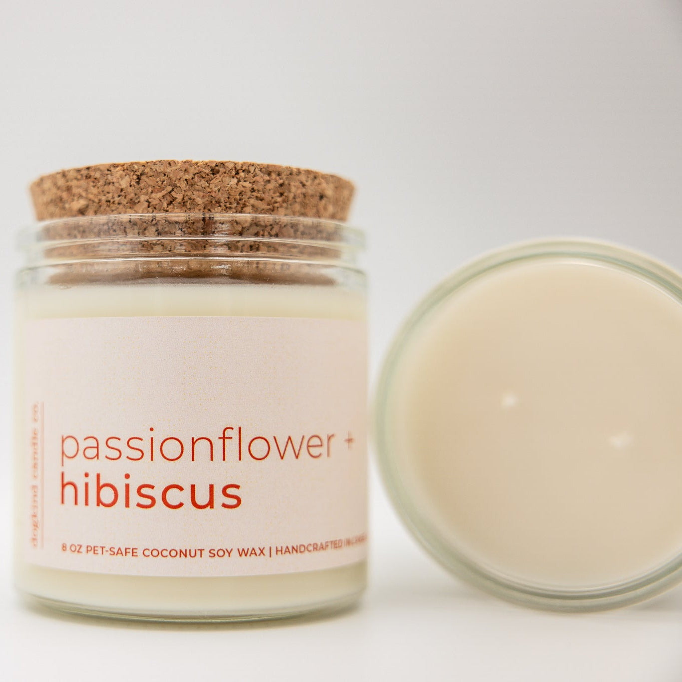 
                  
                    Candle jar labeled 'passionflower hibiscus' with a cork lid on a white background
                  
                