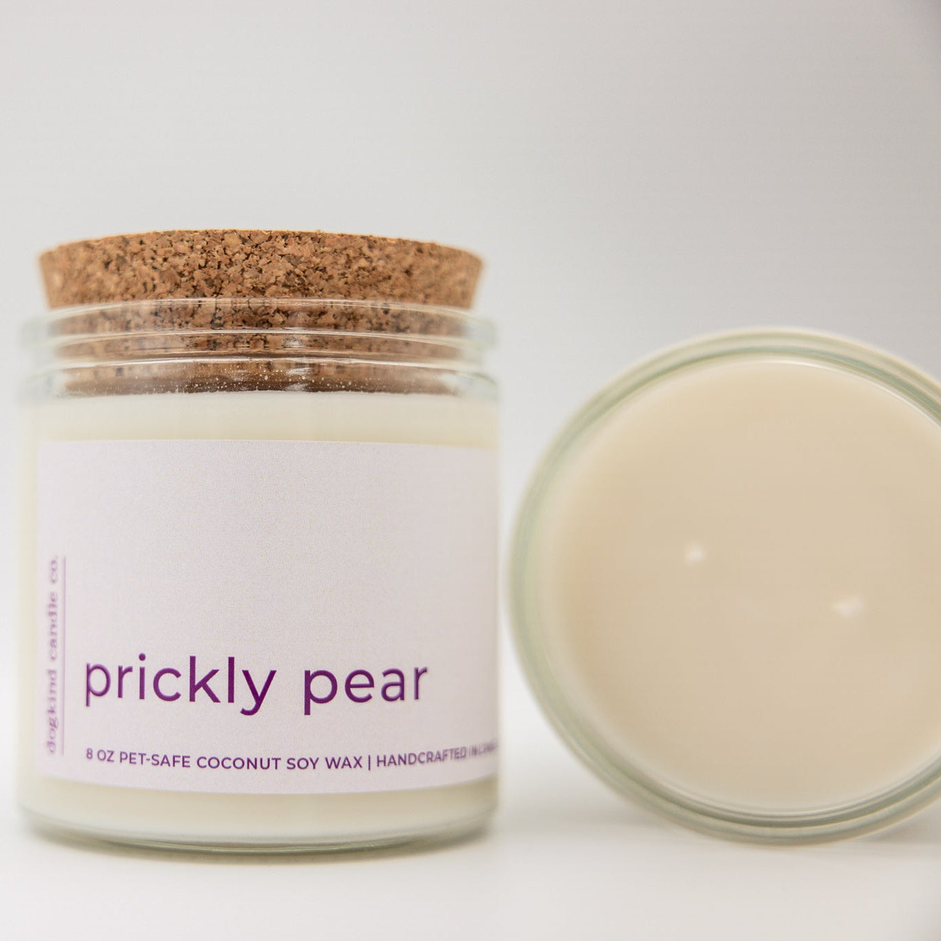 
                  
                    Candle jar labeled 'prickly pear' with a cork lid on a white background
                  
                