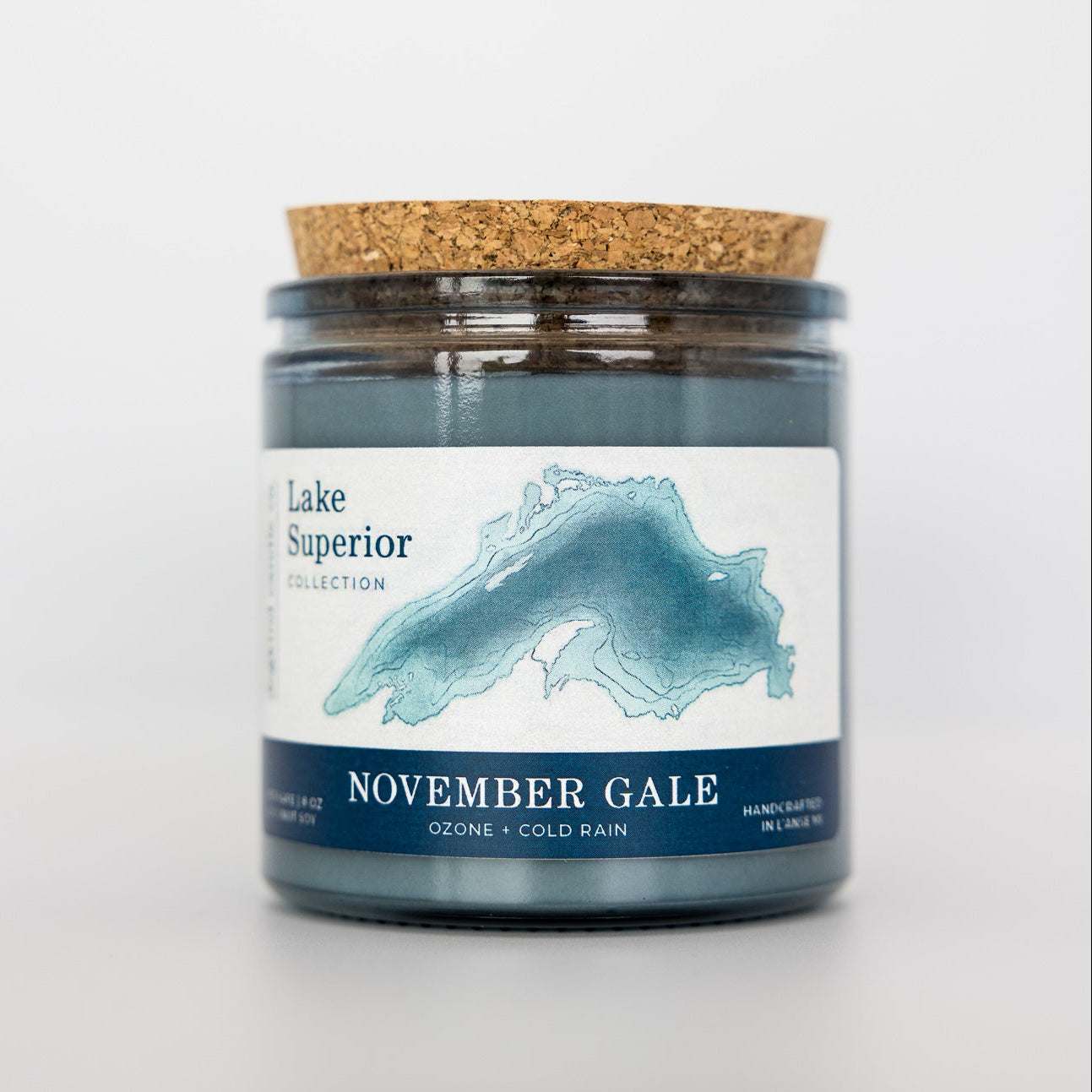 Candle jar labeled 'Lake Superior November Gale' with a cork lid on a light gray background