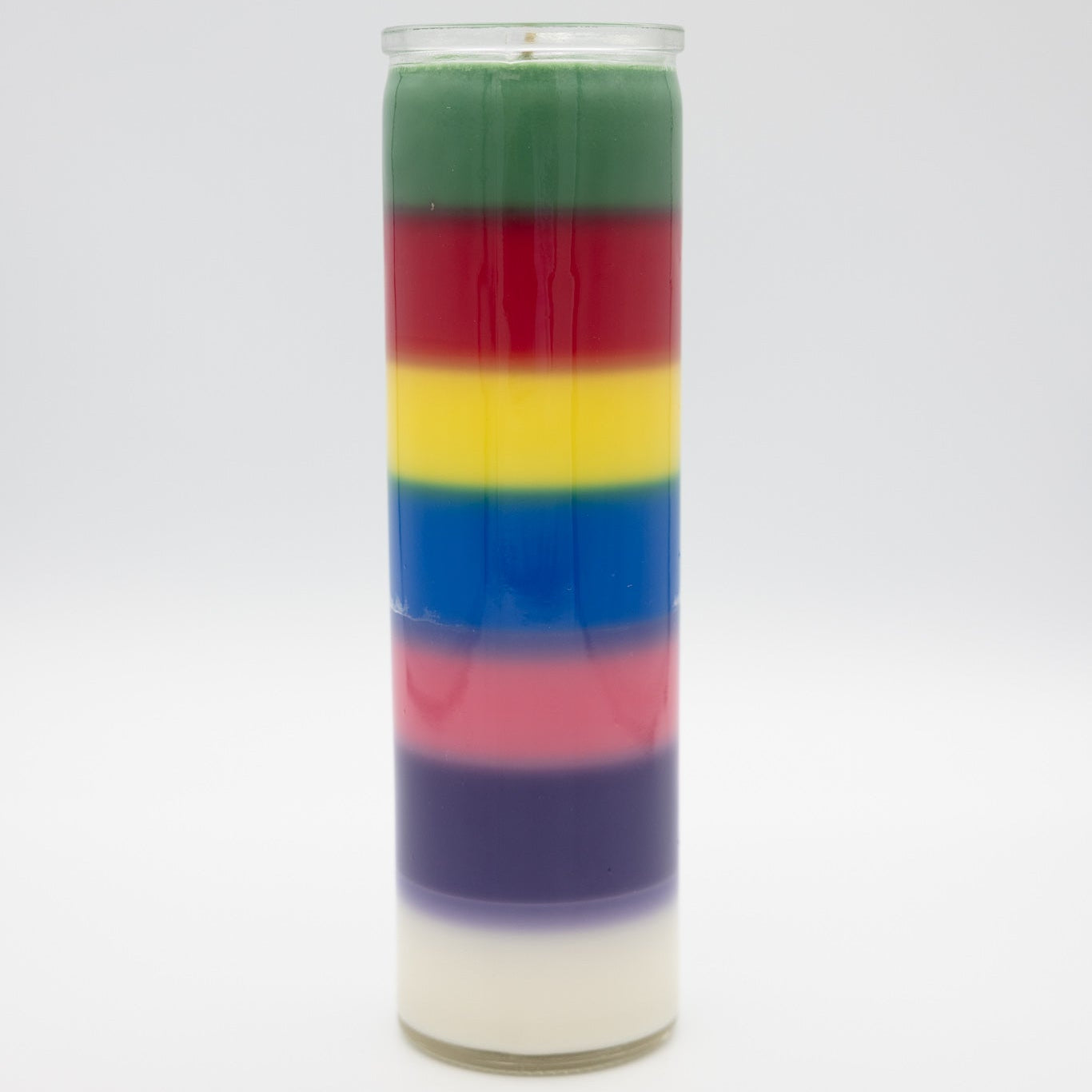 
                  
                    A 7-day prayer candle filled with seven horizontal layers of green, red, yellow, blue, pink, purple, and white wax, set against a plain light gray background.
                  
                
