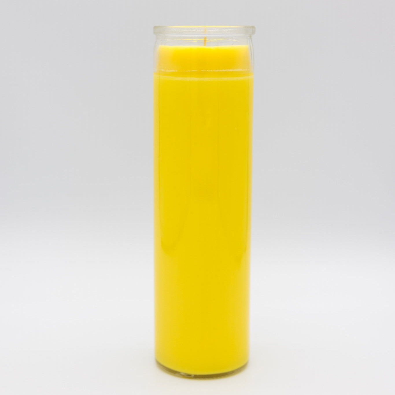 
                  
                    A 7-day prayer candle filled with bright yellow wax, set against a seamless light gray studio background.
                  
                