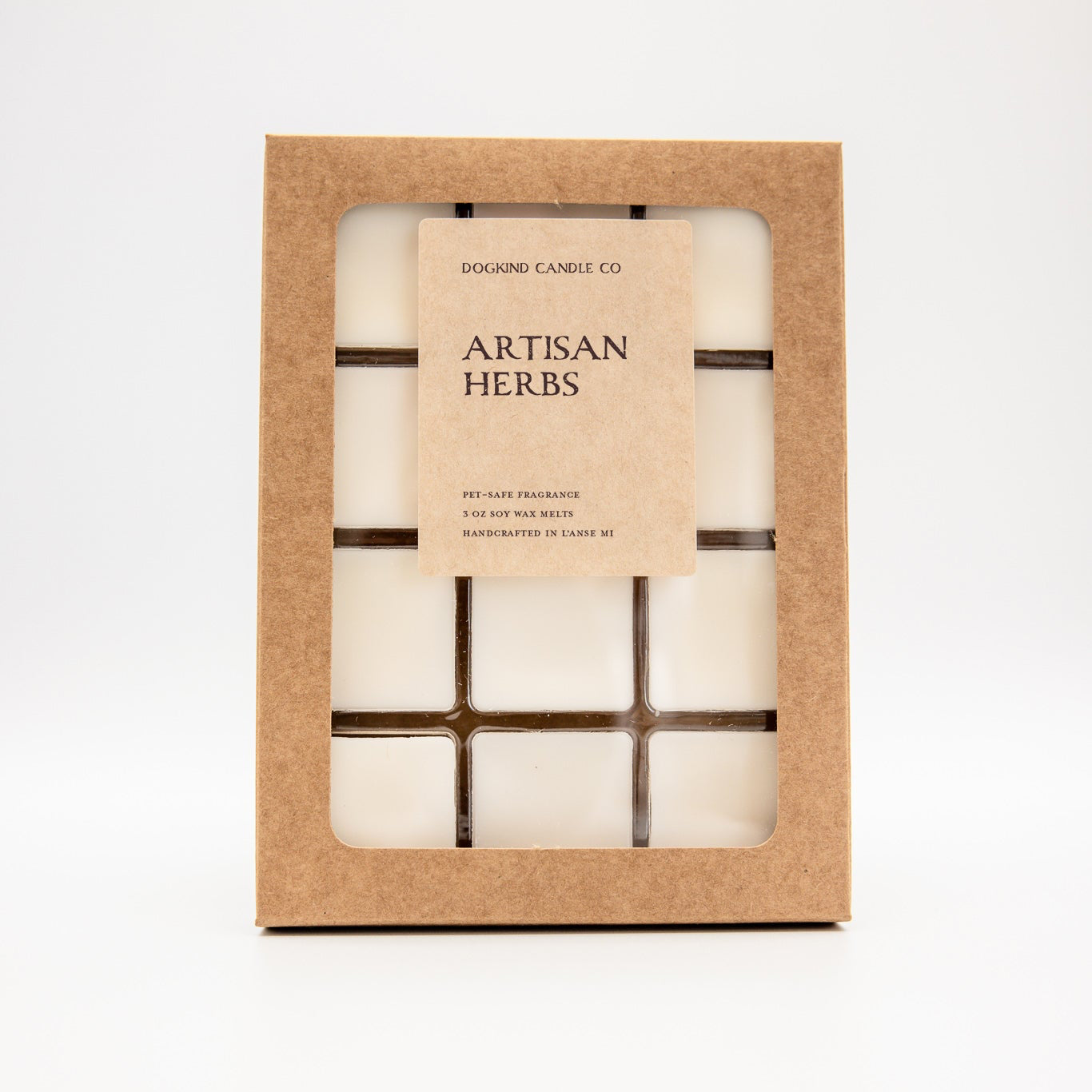 A boxed wax melt set labeled 'Artisan Herbs' by Dogkind Candle Co, shown in a kraft paper window box on a clean white background.