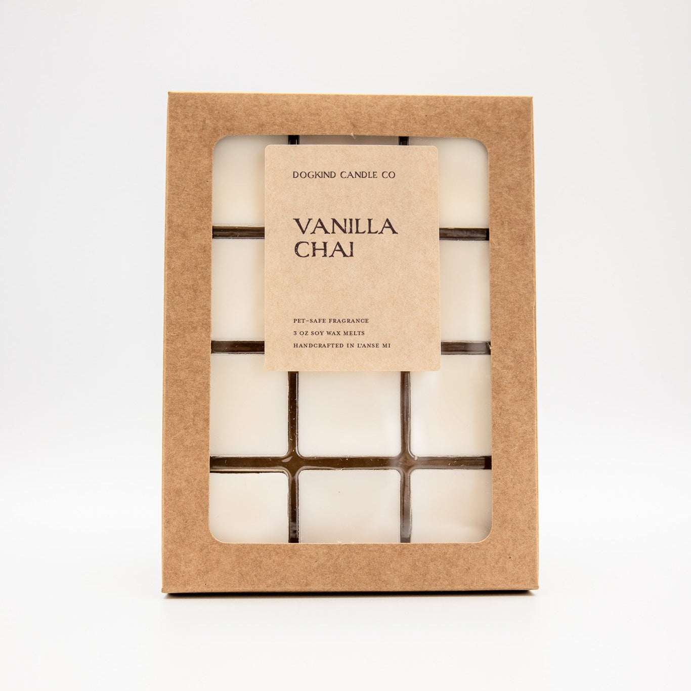 A boxed set of vanilla chai wax melts by Dogkind Candles Co. in a kraft paper window box, shown on a clean white background.